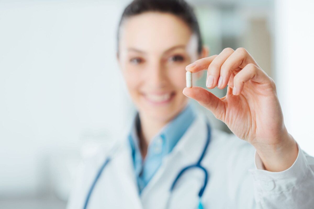 Doctor holding a medicine pill